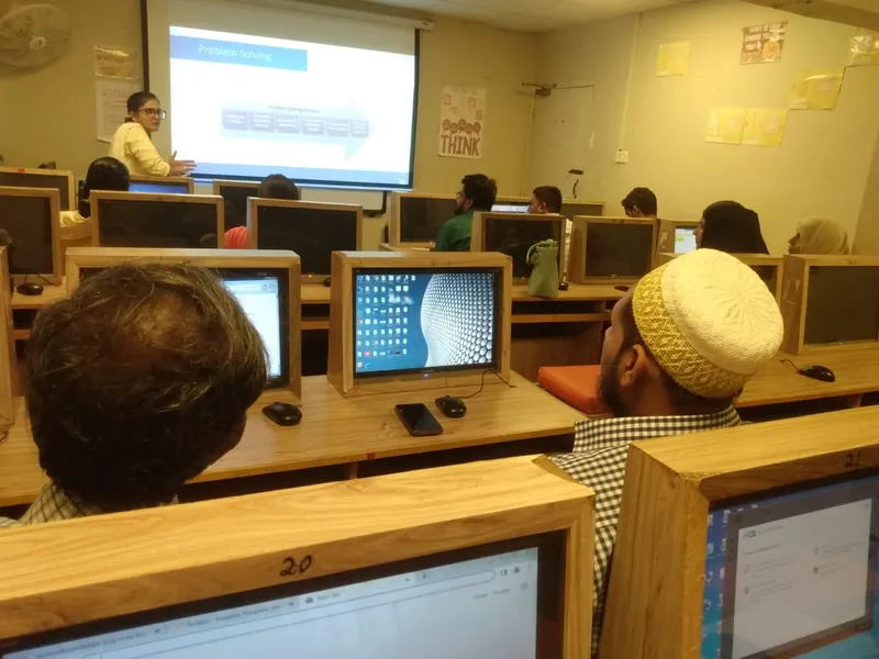 Teachers at computers during an AITEP session